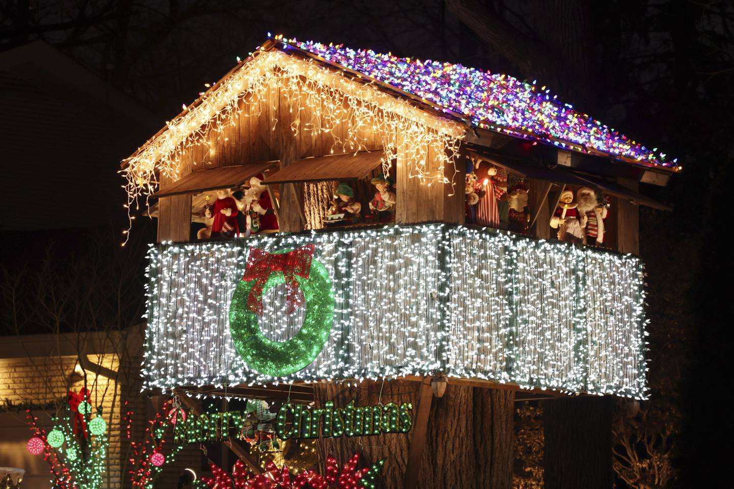 A treehouse is decorated with holiday lights in front of a house on Dec. 10, 2022, in Lincolnwood.