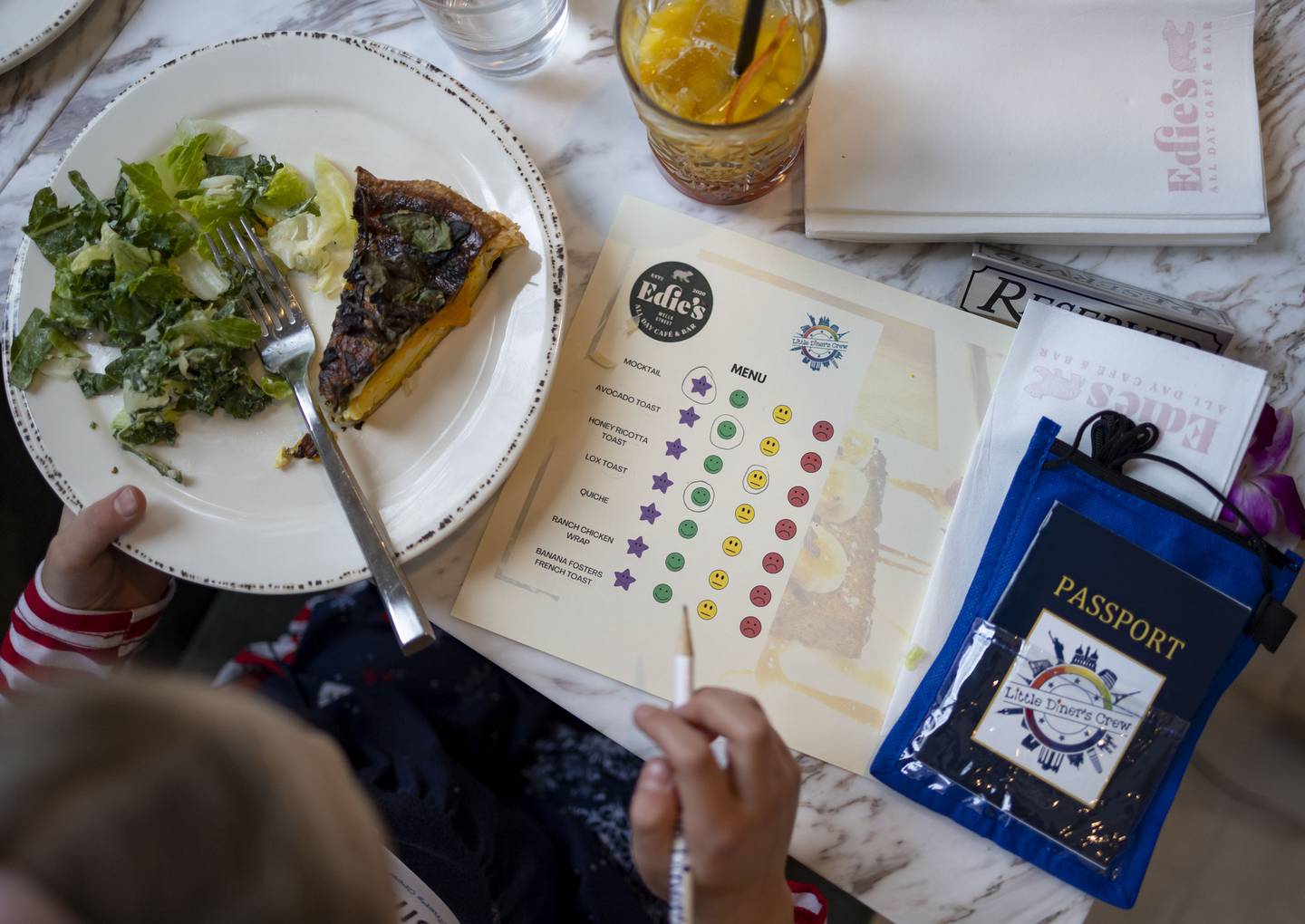Kids use score sheets to rate each item including the quiche, during a brunch with the Little Diner’s Crew.