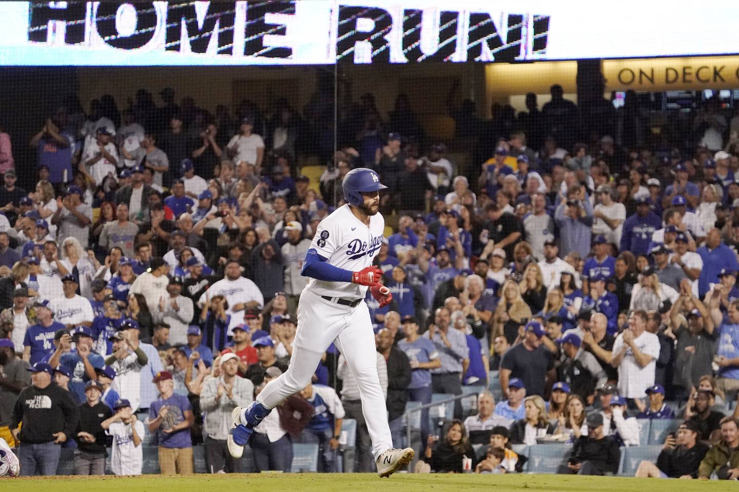The Dodgers' Joey Gallo heads back to the dugout after hitting a solo home run during the fifth inning against the Rockies on Oct. 4, 2022.