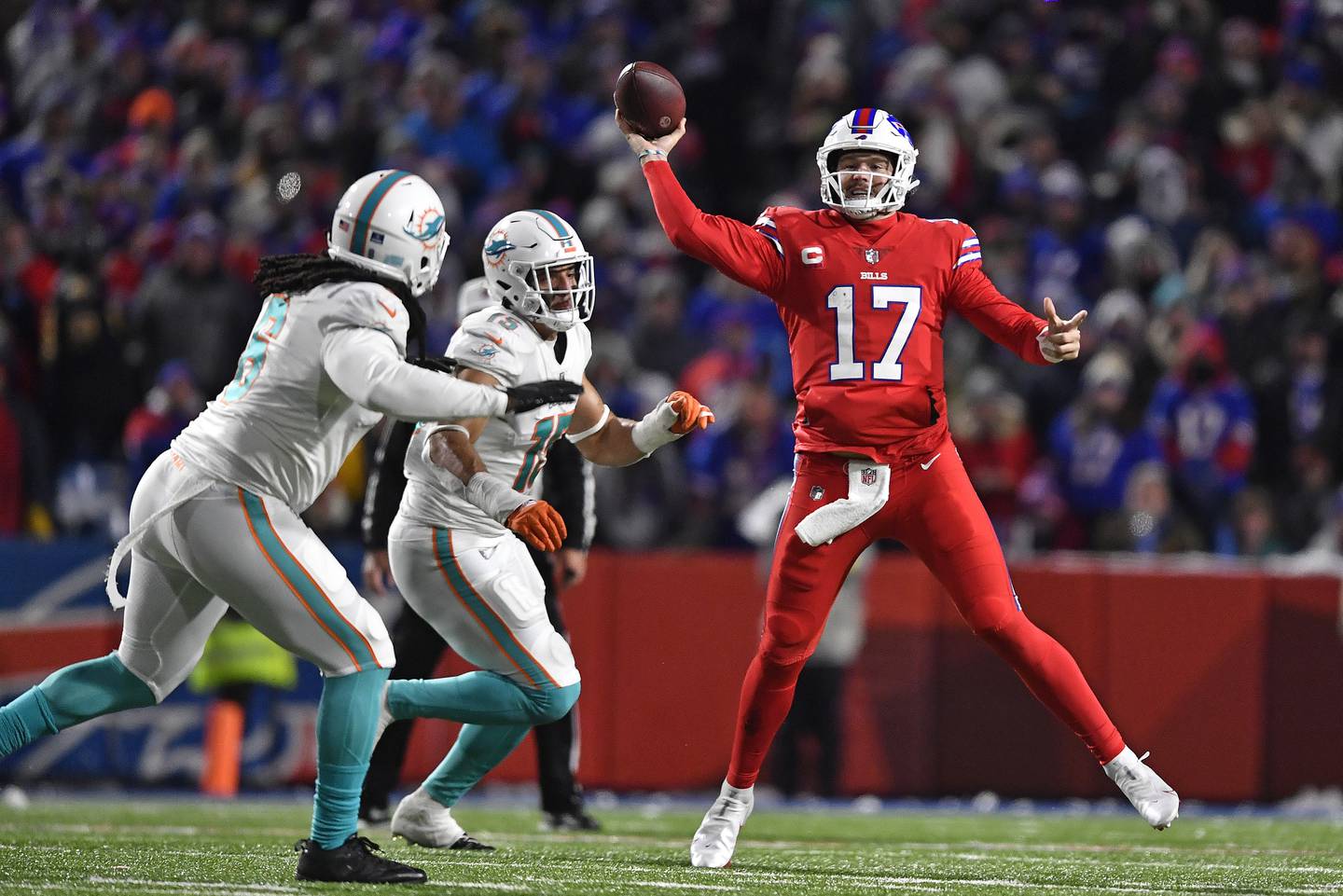 Bills quarterback Josh Allen gets off a pass during the second half against the Dolphins on Dec. 17, 2022.