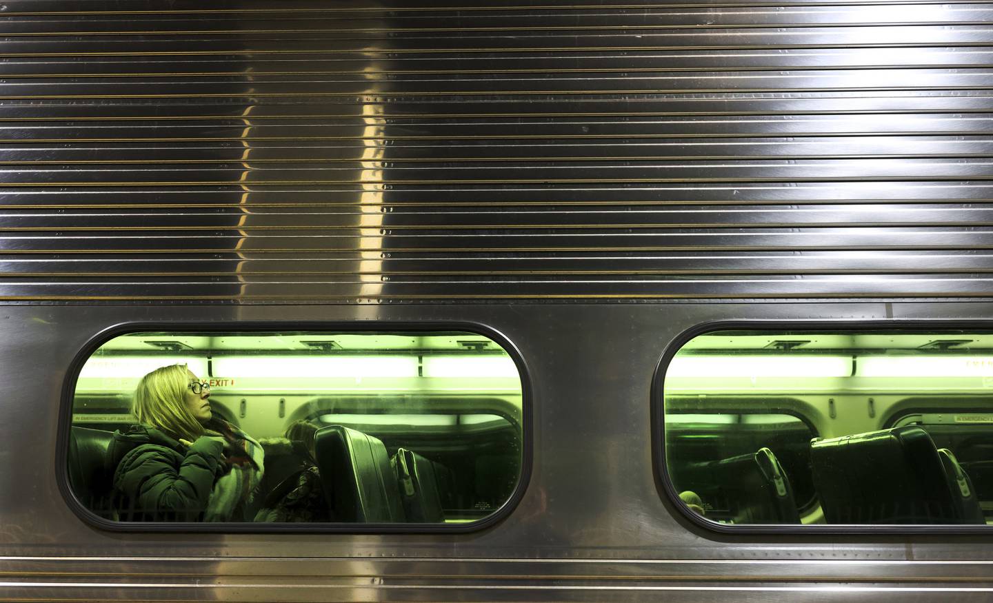 A commuter gets settled aboard a Metra Heritage Corridor line bound for Joliet at Union Station in downtown Chicago on Dec. 7, 2022.  The Heritage Corridor line has among the lowest ridership of any commuter line.