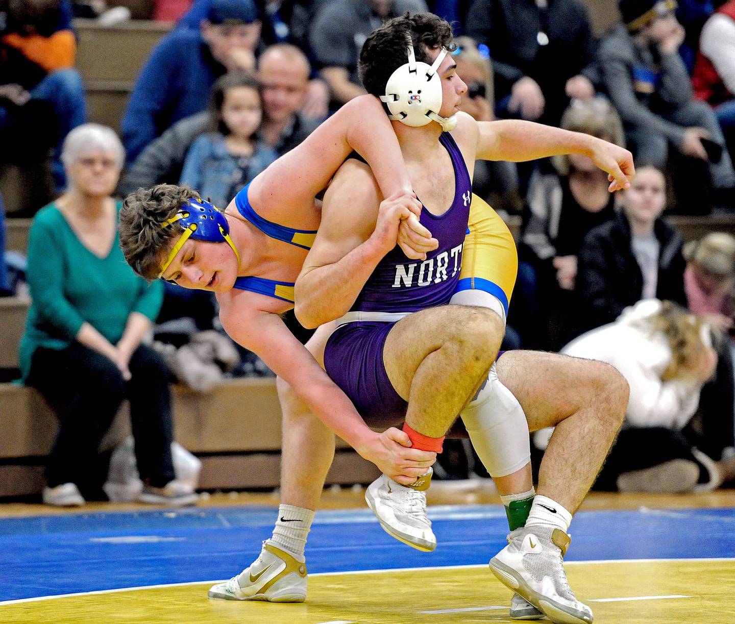 Lyons’ Griffin King, left, wrestles against Downers Grove North’s Ben Bielawski in the championship match at 182 pounds during the Class 3A Lyons Regional in La Grange on Saturday, Feb. 8, 2020.