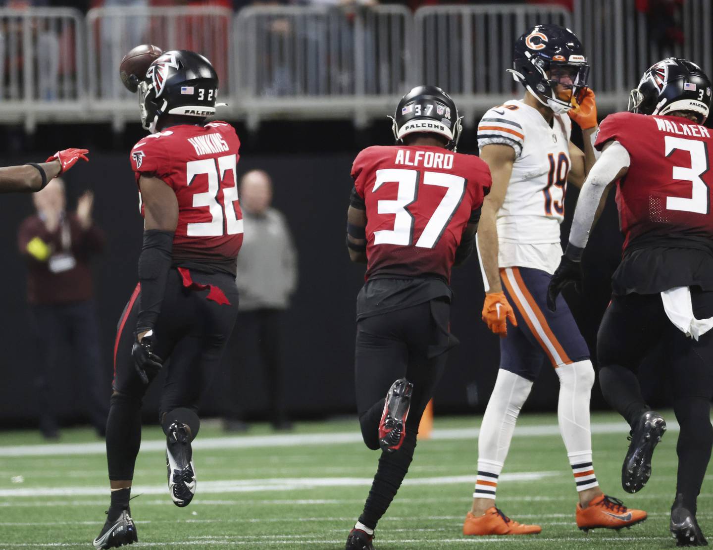 Bears wide receiver Equanimeous St. Brown (19) heads to the sideline after the final offensive drive results in an interception by Falcons safety Jaylinn Hawkins (32) on Nov. 20, 2022, in Atlanta.