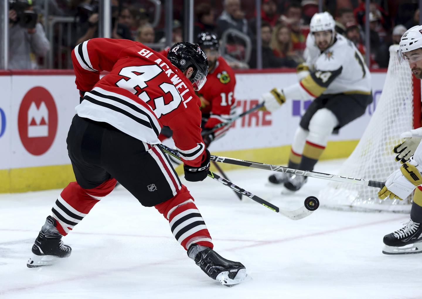 Blackhawks center Colin Blackwell tries to gain control of the puck in the first period against the Golden Knights at the United Center on Dec. 15, 2022.