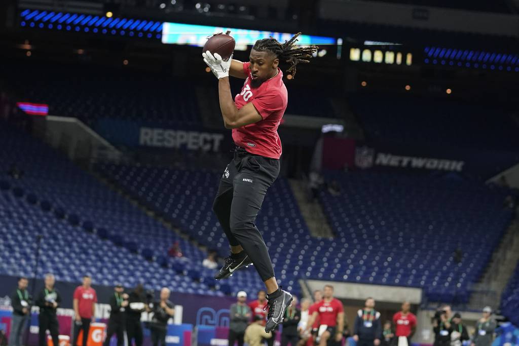 TCU wide receiver Quentin Johnston runs a drill at the NFL combine on March 4, 2023.