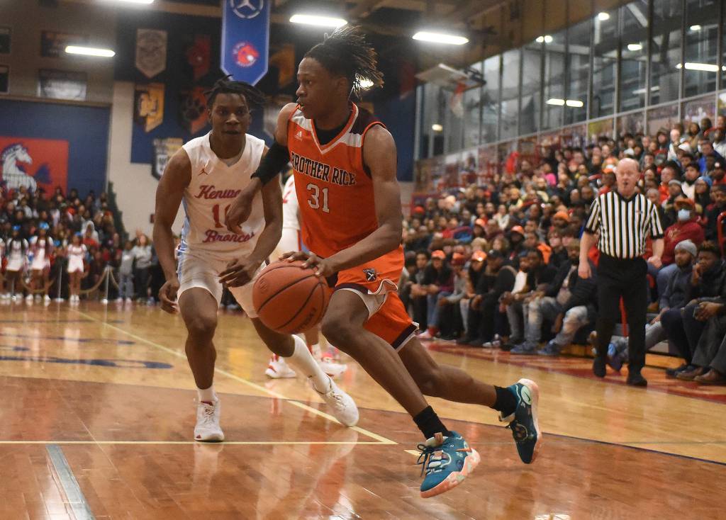 Brother Rice's Khalil Ross (31) drives the baseline against Kenwood during the Class 4A St. Rita Sectional championship game in Chicago on Friday, March 3, 2023.