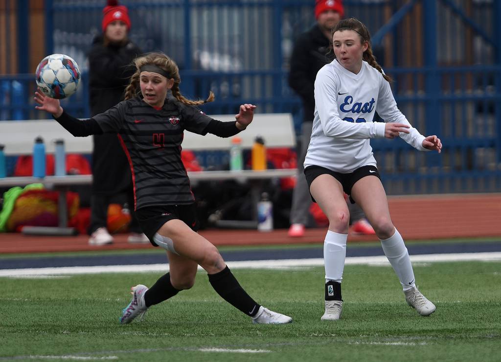 Lincoln-Way Central's Christine Erdman (4) tries to control the ball against Lincoln-Way East's Bre Herlihy (20) during the Windy City Ram Classic semifinals at Reavis in Burbank on Tuesday, March 21, 2023.