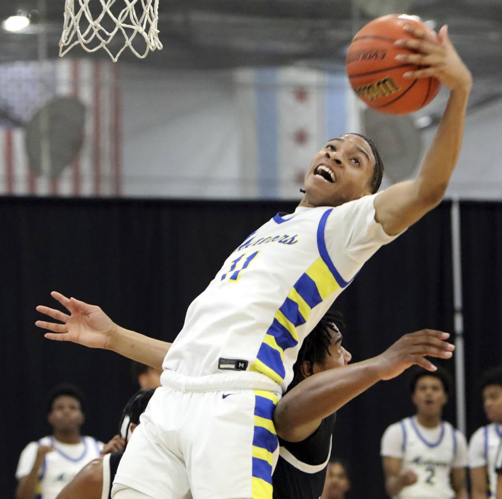 De La Salle's Evan Jackson grabs a rebound against Fenwick during a Class 3A De La Salle Sectional semifinal in Chicago on Tuesday, Feb. 28, 2023.