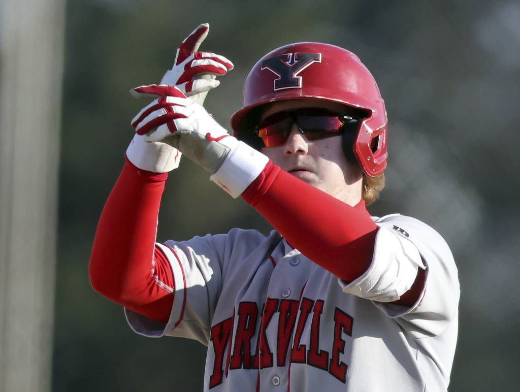 Yorkville's Ryan Weis (4) reacts to his double against Marmion during a nonconference game in Aurora on Tuesday, March 28, 2023.