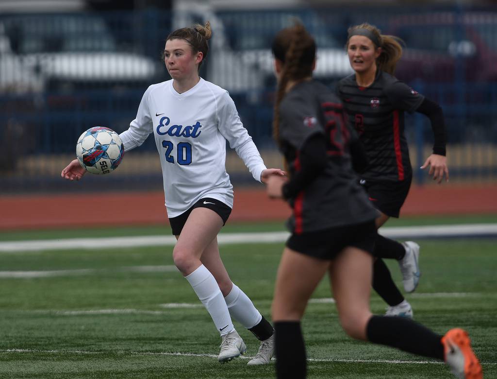 Lincoln-Way East's Bre Herlihy (20) dribbles up the field against Lincoln-Way Central during the Windy City Ram Classic semifinals at Reavis in Burbank on Tuesday, March 21, 2023.