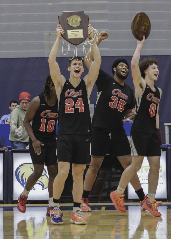 Colton Schutt (24) and Waubonsee Community College teammates Jaylyn Kelley (10), Brice Langford (35) and Joey Niesman (0) celebrate qualifying for nationals by winning the Region IV Tournament in Rockford on Saturday, March 11, 2023.