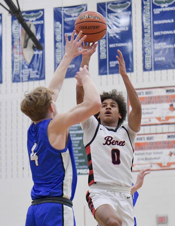 Benet’s Brayden Fagbemi (0) lofts a shot over Geneva’s Tanner Dixon (4) during the Class 4A Bartlett Sectional championship game on Friday, March 3, 2023. 