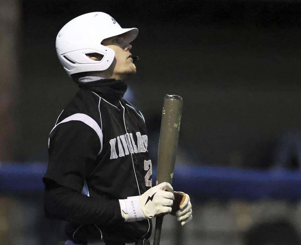 Kaneland's Parker Violett (26) pauses before batting against Harvest Christian during a nonconference game at Judson's Hoffer Field in Elgin on Tuesday, March 21, 2023.