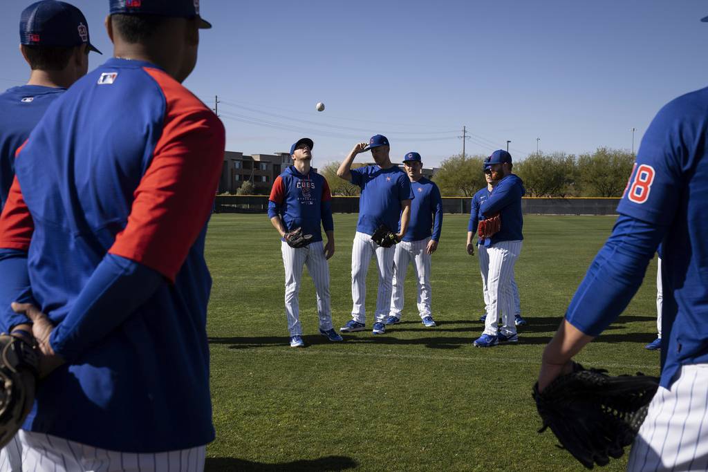 Cubs pitchers “pick teams” before a drill during practice at Sloan Park in Mesa, Arizona on Feb. 23, 2023. 