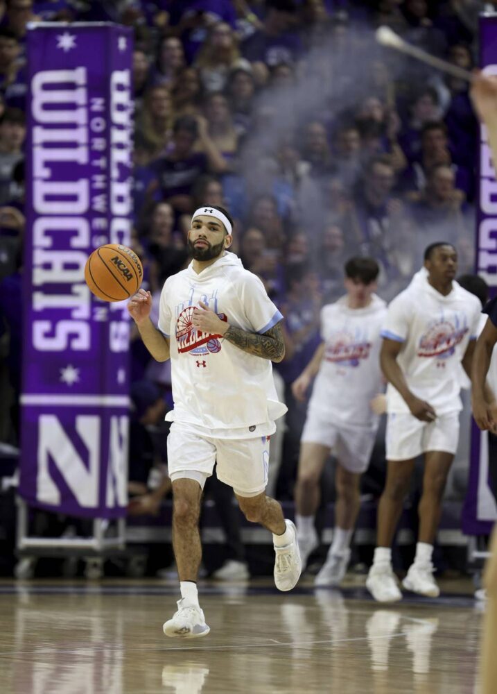 Northwestern guard Boo Buie hits the court for warmups on March 1, 2023, at Welsh-Ryan Arena in Evanston.
