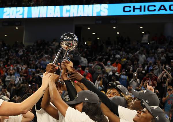 Chicago Sky players hold celebrate after winning the WNBA championship on Oct. 17, 2021, at Wintrust Arena.