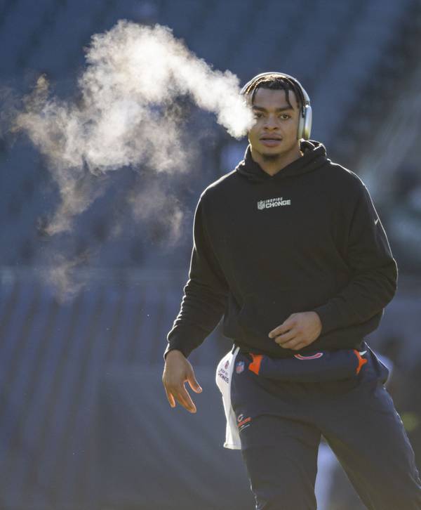 Bears quarterback Justin Fields warms up in the cold on Dec. 18, 2022, at Soldier Field.