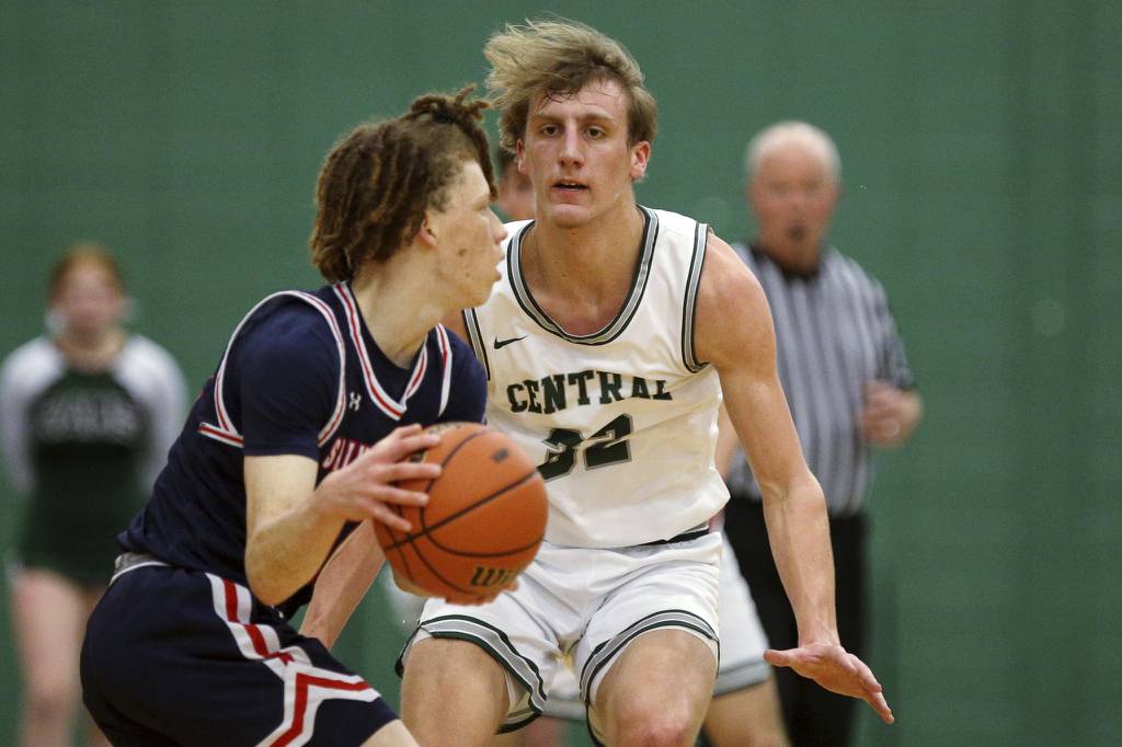Grayslake Central’s Jake Gibson (32) guard St. Viator’s Henry Marshall during a Class 3A Grayslake Central Sectional semifinal on Wednesday, March 1, 2023. 