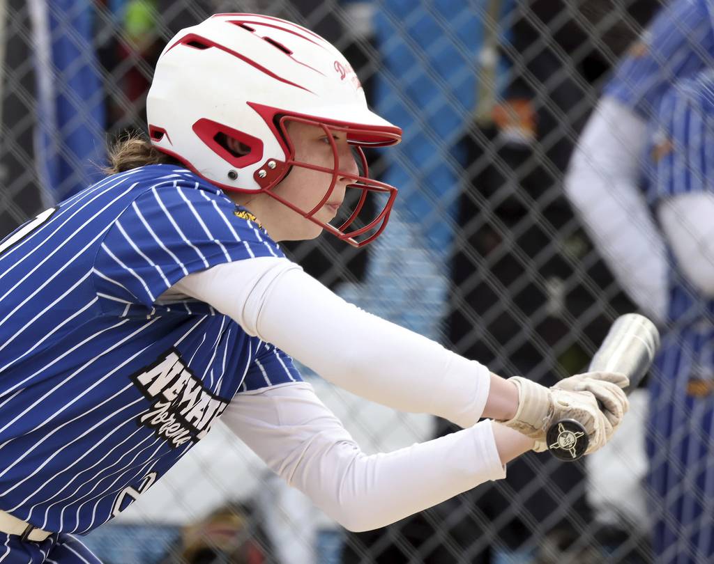 Newark's Kodi Rizzo (20) puts down a bunt against Rosary during a nonconference game on Thursday, March 30, 2023.