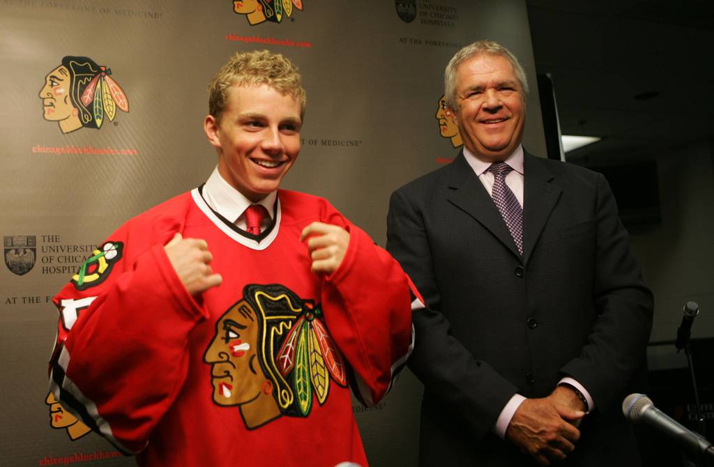 Patrick Kane, the No. 1 pick in the 2007 NHL draft, tries on his new Blackhawks sweater alongside GM Dale Tallon.