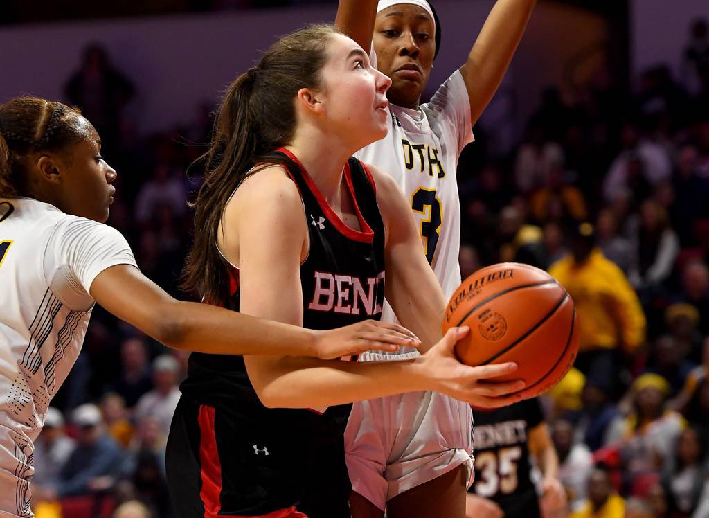 Benet’s Samantha Trimberger, center, gets fouled by O’Fallon’s Shannon Dowell, left, on her way to the basket during the Class 4A state championship game at Illinois State’s CEFCU Arena in Normal on Saturday, March 4, 2023. 