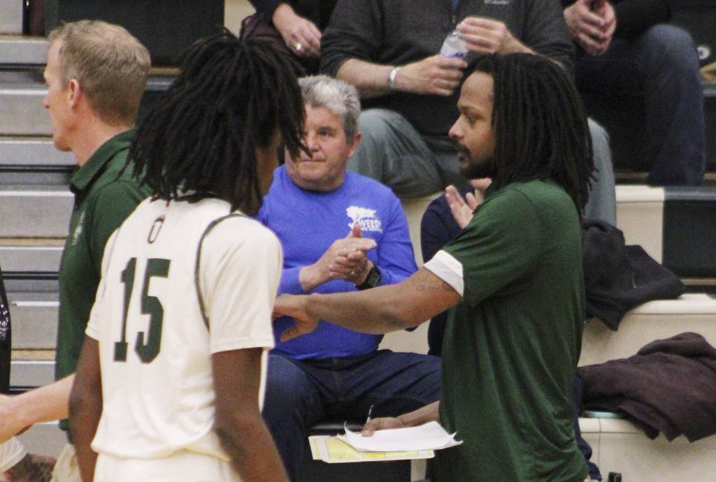 Adams State University assistant coach Rickey Norris, right, works a game in Alamosa, Colorado. 