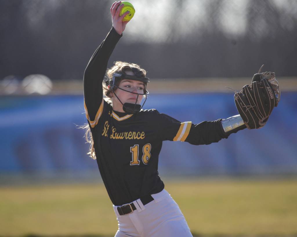 St. Laurence’s Sarah Klonowski (18) delivers a pitch against Sandburg during a nonconference game in Orland Park on Monday, March 27, 2023.