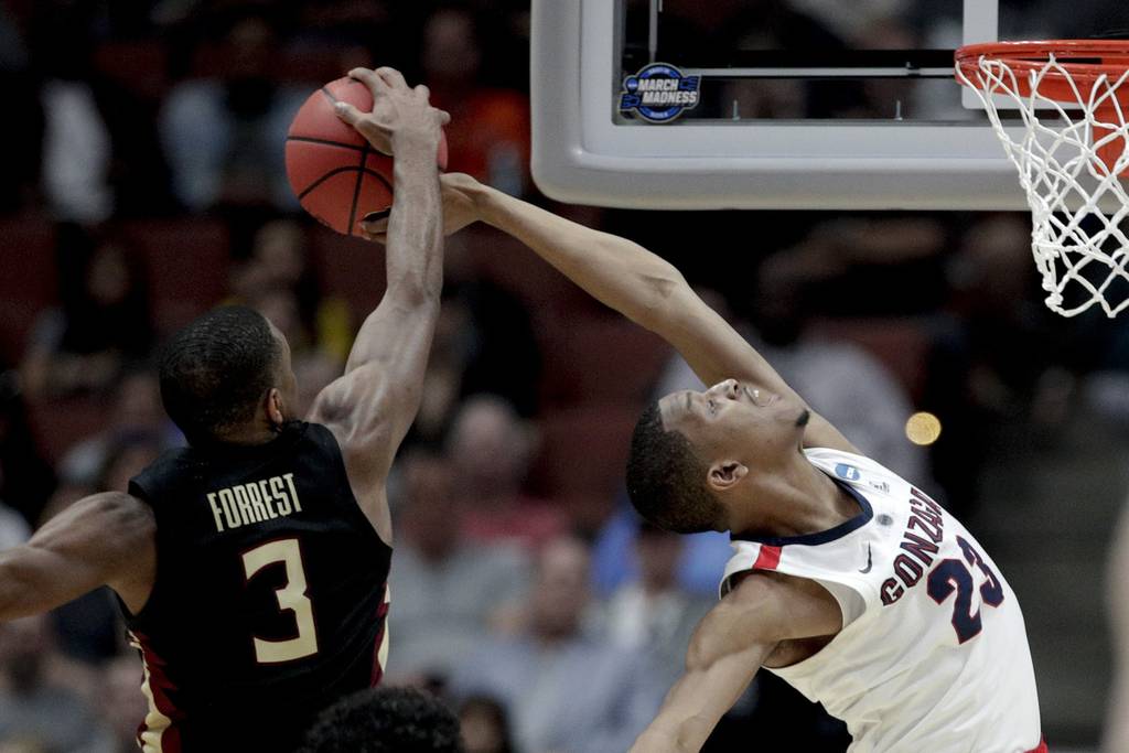 Gonzaga's Zach Norvell, right, and Florida State's Trent Forrest battle in a NCAA tournament West Region semifinal, March 28, 2019, in Anaheim, California. 