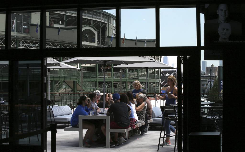 Visitors dine at the second floor outdoor seating area at the Brickhouse Tavern on June 27, 2017.  