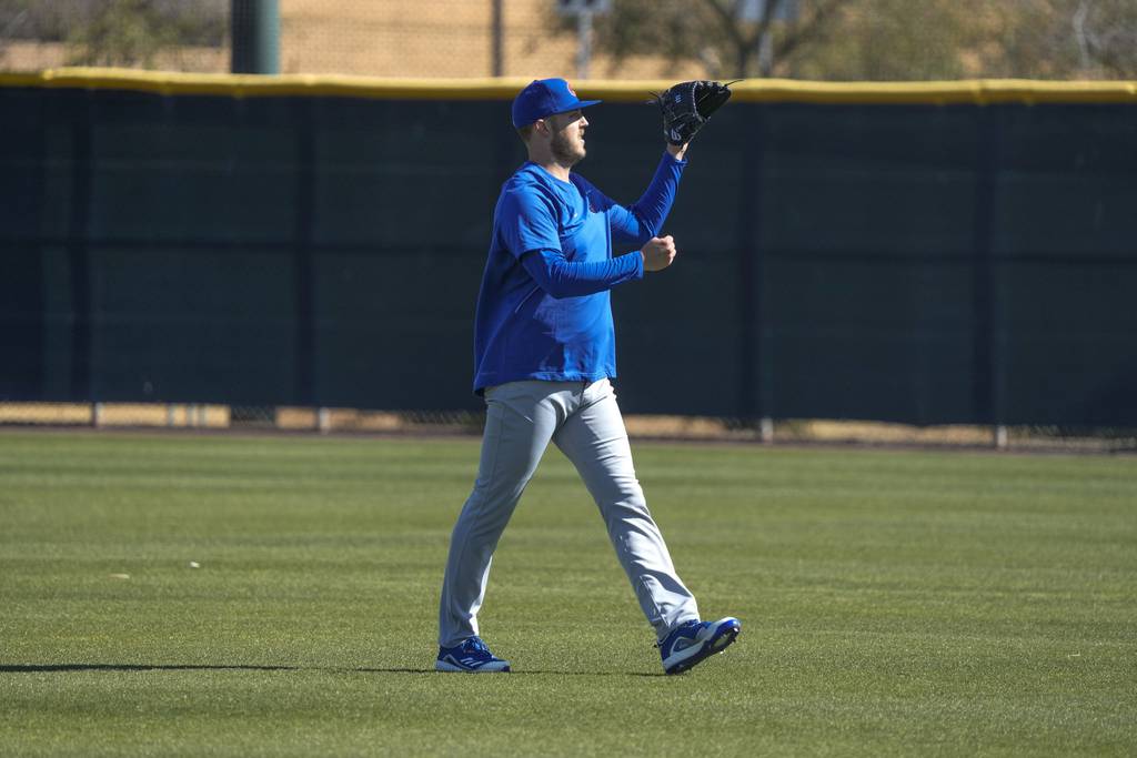 Jameson Taillon catches a ball during a Cubs spring training workout on Feb. 15, 2023.