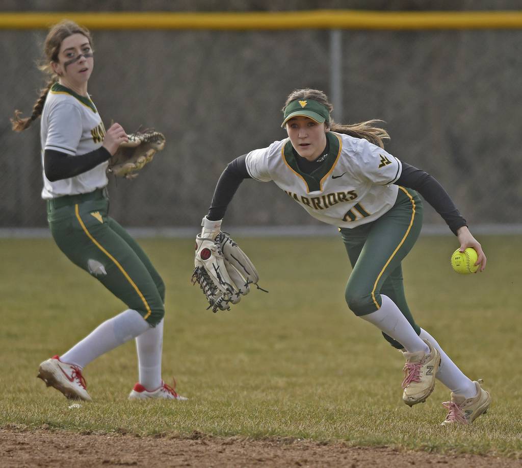 Waubonsie Valley's Gia Cobert (21) runs the ball back in to the infield after fielding a short fly ball against West Chicago during a nonconference game in Aurora on Thursday, March 23, 2023.