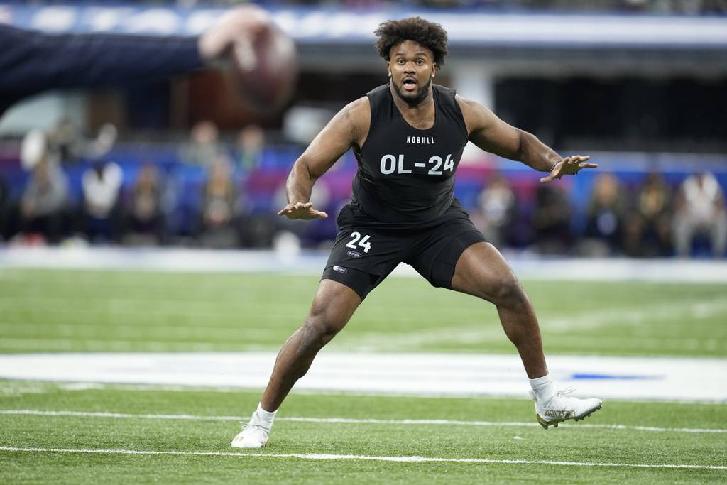 Ohio State offensive lineman Paris Johnson Jr. runs a drill at the NFL combine on March 5, 2023.