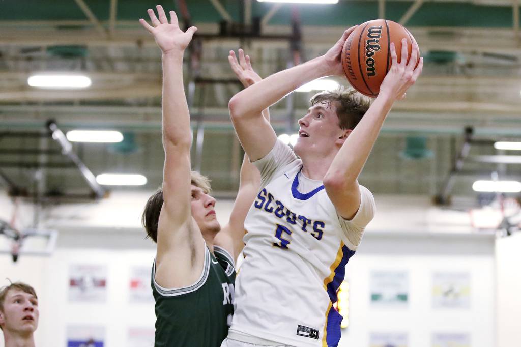 Lake Forest’s Asa Thomas (5) looks to shoot against Grayslake Central’s Jake Gibson during the Class 3A Grayslake Central Sectional championship game on Friday, March 3, 2023.  