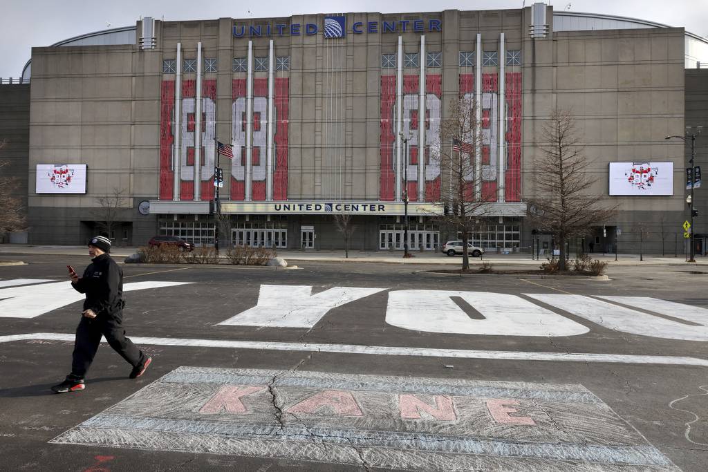 Former Chicago Blackhawks player Patrick Kane is honored with his number adorning the facade of the United Center and thank you messages created with chalk in a parking lot on Thursday.  Kane, a Hawks great, was traded to the Rangers on Tuesday. 