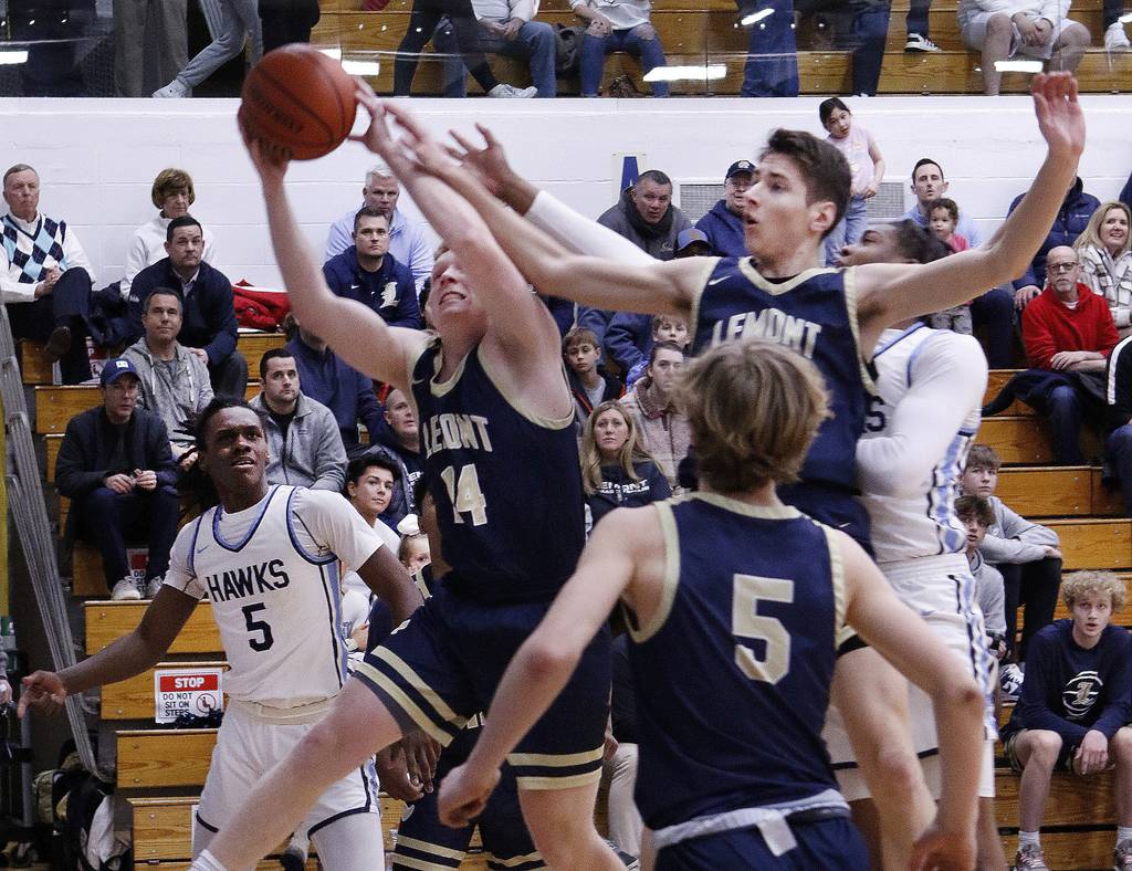 Lemont's Conor Murray (14) pulls down a rebound against Hillcrest during the Class 3A Hillcrest Sectional championship game in Country Club Hills on Friday, March 3, 2023.