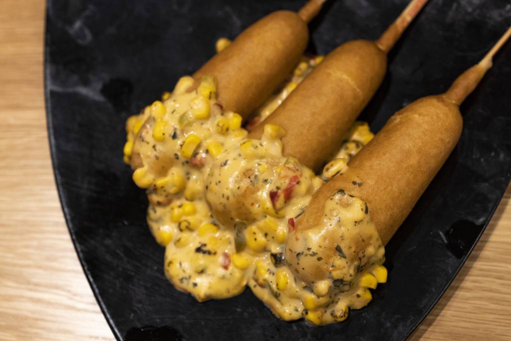 The classic ballpark corn dog got a makeover for White Sox games this season at Guaranteed Rate Field. This new item is smothered in creamy queso fresco and topped with fresh jalapenos, grilled corn, cilantro and cotija cheese.
