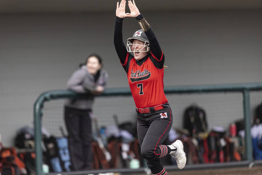Marist’s Maia Pietrzak (7) is all smiles after hitting a two-run homer against Evergreen Park during a nonconference game in Evergreen Park on Thursday, March 23, 2023.