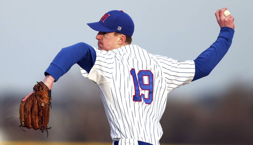 Marmion's James Kennedy (19) throws a pitch against Aurora Central Catholic during a nonconference game in Aurora on Monday, March 20, 2023.
