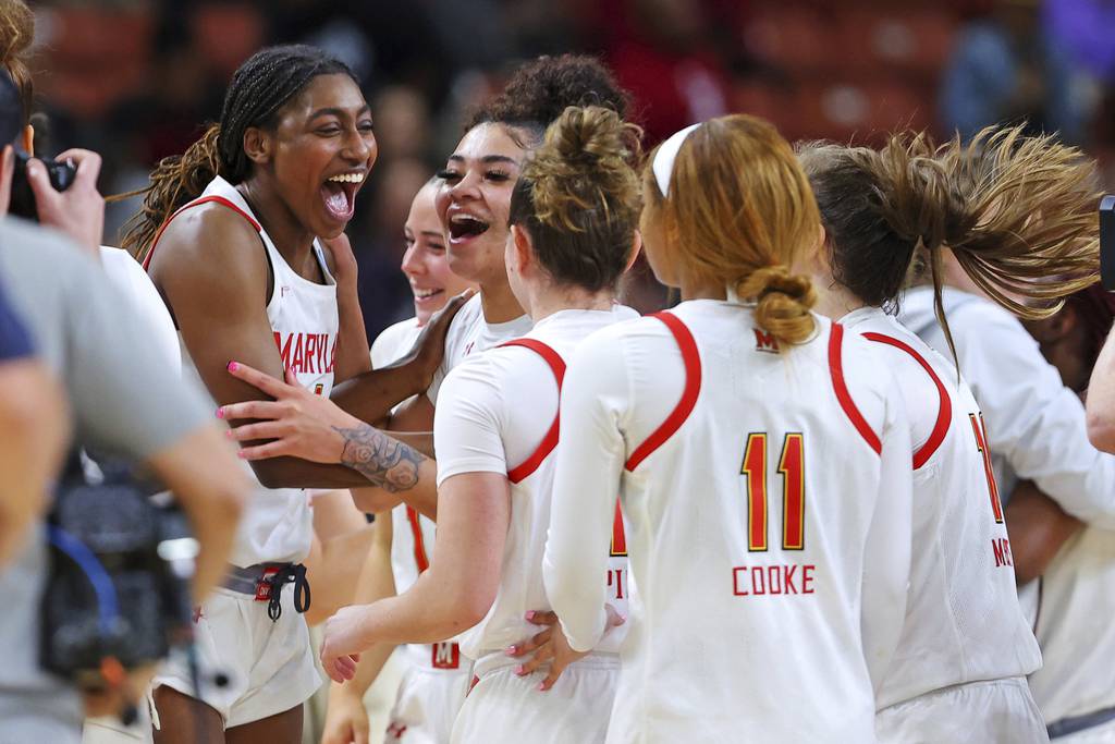 Maryland's Diamond Miller celebrates with her teammates after a win over Notre Dame in Saturday's NCAA Tournament Sweet 16 game at Bon Secours Wellness Arena in Greenville, South Carolina.