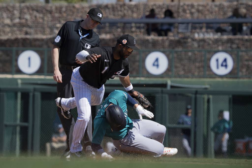 Second baseman Elvis Andrus tags out the Mariners' Jarred Kelenic on a steal attempt during the White Sox’ 10-1 Cactus League victory on Monday at Camelback Ranch in Glendale, Ariz. 