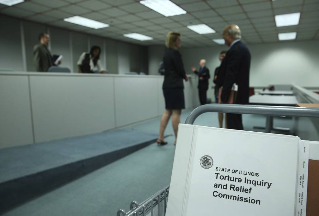 Binders are stacked on a cart after a meeting of the Torture Inquiry and Relief Commission at the Thompson Center on Sept. 21, 2016, in Chicago.