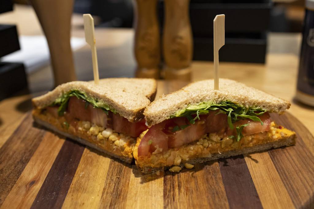 The “gonzo garbanzo” sandwich is filled with seasoned chickpeas, red-pepper hummus, avocado, arugula and a massive tomato slice wrapped between two pieces of wheat berry bread. The sandwich is a vegan option for White Sox fans this season at Guaranteed Rate Field. 