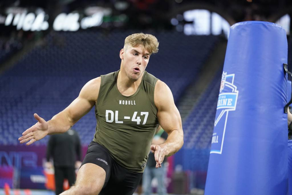 Iowa defensive lineman Lukas Van Ness runs a drill at the NFL combine on March 2, 2023. 