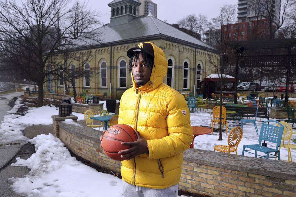 Former Simeon basketball player Josh Thomas lives in Milwaukee, seen on Feb. 27, 2023, in they city’s 3rd Ward near the Milwaukee Bay. Thomas said he appreciates the city’s relative calm compared to Chicago and is still working toward a career as a professional basketball player. 
