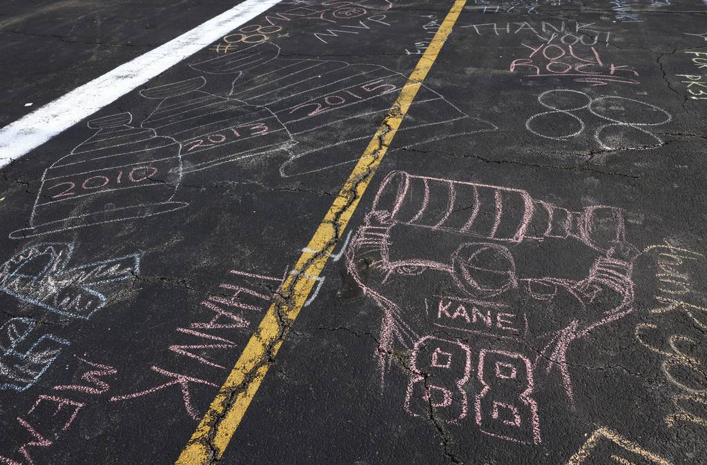 Former Blackhawks player Patrick Kane is honored with thank-you messages created with chalk in a parking lot outside of the United Center on Thursday. Kane was traded to the Rangers on Tuesday.
