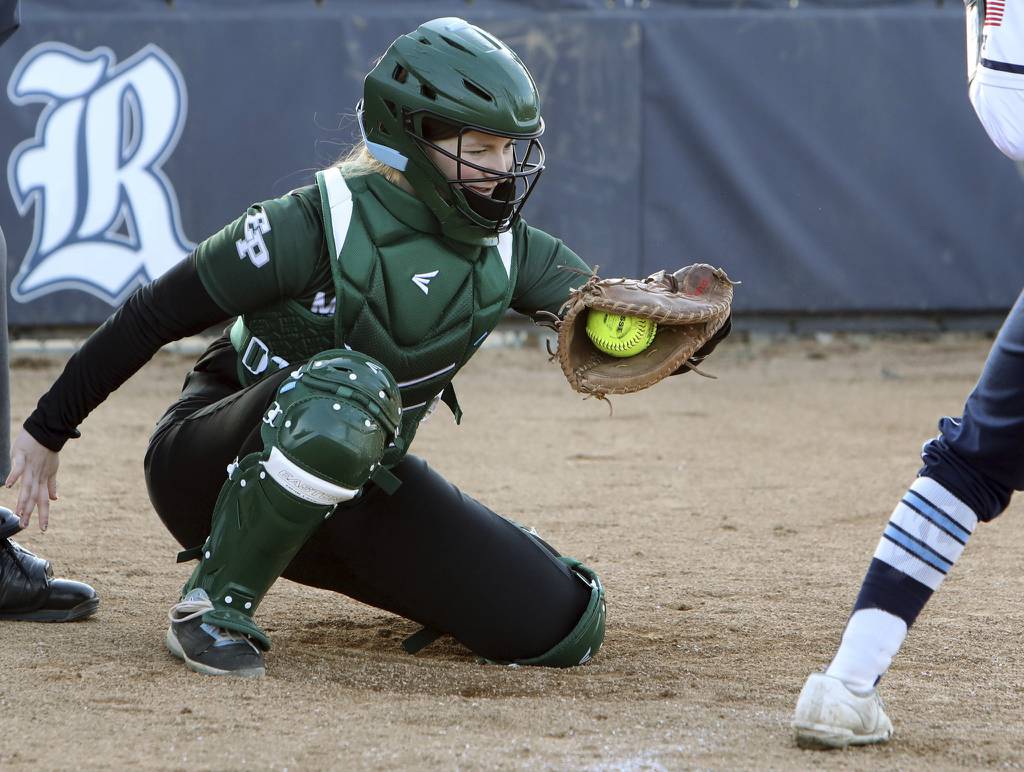 Evergreen Park catcher Jackie Jones frames a pitch against Reavis during a South Suburban Red game in Burbank on Tuesday, March 28, 2023.