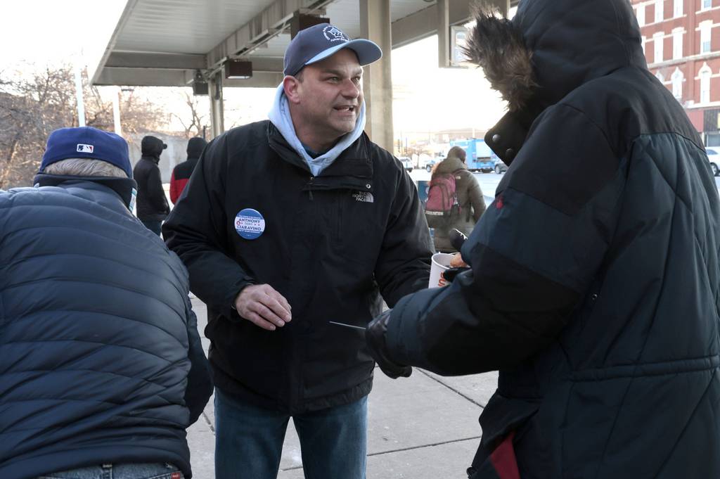 Candidate for 11th Ward alderman Anthony “Tony” Ciaravino greets bus and train commuters while offering them free coffee outside the CTA's Halsted Orange Line station at Archer on March 14, 2023.