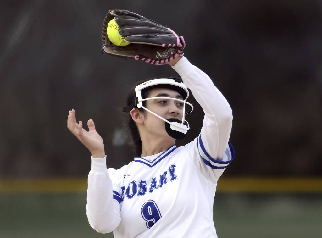 Rosary shortstop Ellie Figueras (9) secures a pop-up against Newark in a nonconference game on Thursday, March 30, 2023.