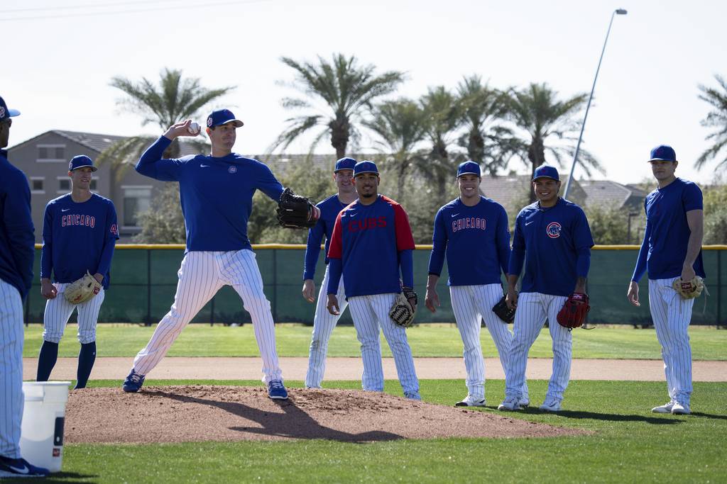 Kyle Hendricks and Cubs pitchers work on pickoff throws during workouts at Sloan Park on Feb. 23 in Mesa, Ariz. 