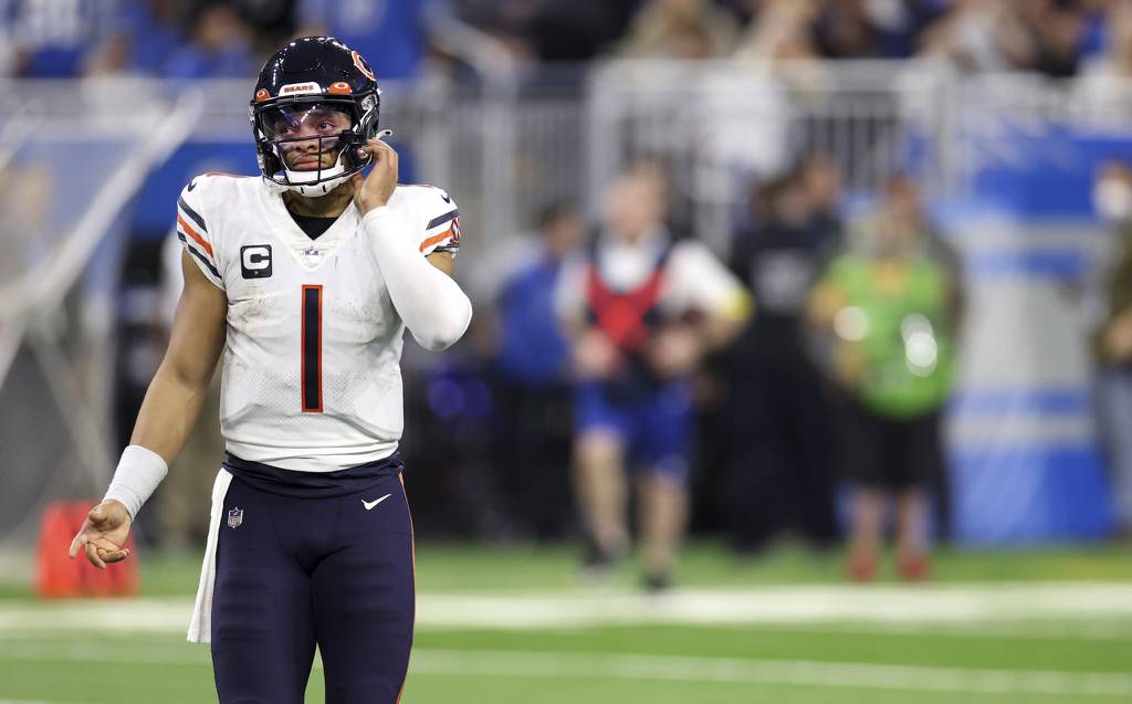 Bears quarterback Justin Fields heads to the locker room after throwing an interception to end the second quarter against the Lions on Jan. 1, 2023, in Detroit.